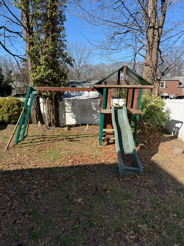 Backyard with playset before removal